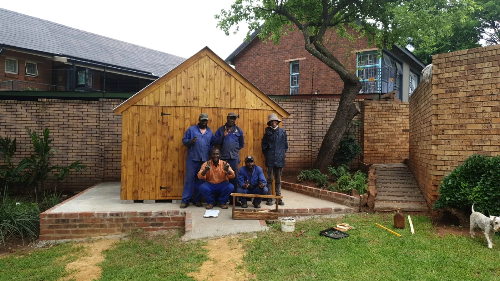 The A&H team standing in front of a freshly built timber shed on a new concrete base